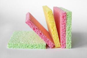 Bright colored sponges for washing dishes, cleaning the bathroom and other household needs. photo