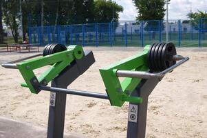 Weight plates on green equipment. photo