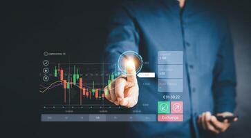 Stock market, planning and strategy, Business growth, progress or success concept. Hand of Businessman or trader touching showing a growing virtual hologram stock on interface, invest in trading. photo