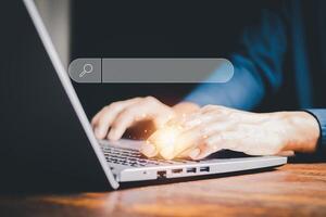 SEO Data Search Technology Search Engine Optimization. man's hands are using a computer laptop to find what they are interested in. Searching for information with your website. internet networking. photo