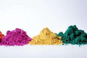 Pile of multicolored holi powder isolated on white background. photo