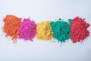 Pile of multicolored holi powder isolated on white background. photo