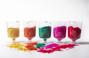 Colorful holi powder in glass bowl on white background. festival of colors photo