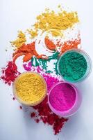 Colorful holi powder in glass bowl isolated on white background. photo