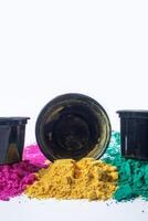 Colorful holi powder isolated on white background with copy space. photo