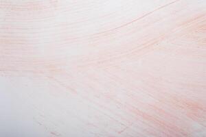 Grunge pink paint strokes on white paper. Abstract background photo