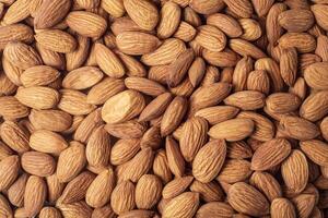 Close up of almond nuts background. Top view. photo