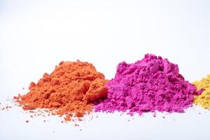 Pile of colorful holi powder isolated on white background. photo