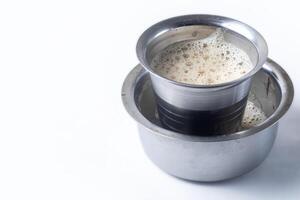 South Indian Filter coffee served on a white background. Closeup photo