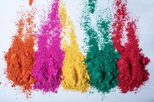 Colorful holi powder isolated on white background. Selective focus. photo