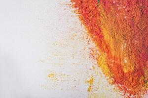 Colorful holi powder on white background. Holi festival concept. photo