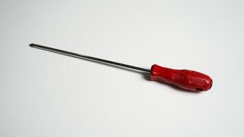 Red screwdriver on white background. photo