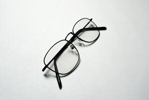 Reading glasses on white background. photo