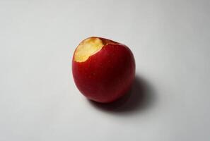 Bite apple on a white background photo