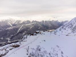 A view of the Krasnaya Polyana ski resort and the snowy mountain landscapes photo