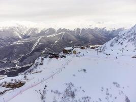 A view of the Krasnaya Polyana ski resort and the snowy mountain landscapes photo