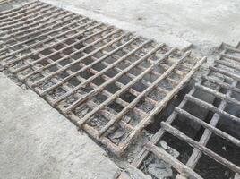 bridge made of rusty round bar iron. the concept of the danger of accidents because iron is brittle and breaks easily photo