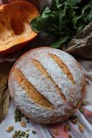 Homemade sourdough bread fresh baked with vegetables and greens decoration photo