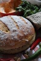 Homemade sourdough bread fresh baked with vegetables and greens decoration photo