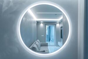 A bright apartment is reflected in a luminous mirror photo