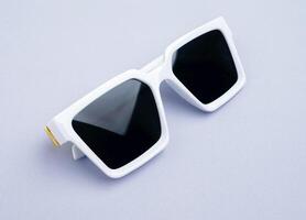 sunglasses isolated on a gray background photo