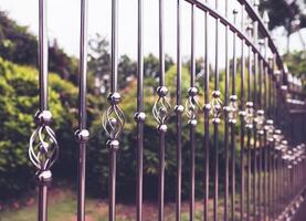 Stainless steel fence is bent into a spiral shape to prevent intrusion. photo