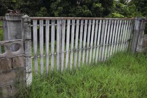 The plank gate was closed to prevent intrusion. photo