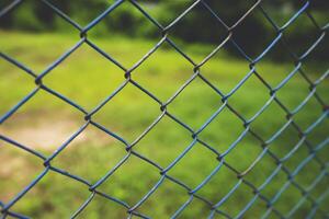 Chain link fence with blurred background . demarcation concept photo