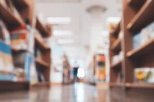 abstract blur background of bookshelf in library photo