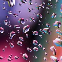 Abstract image of water droplets on glass surface reflecting with multicolored background. photo