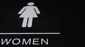 Womens restroom sign on dark background 2 video