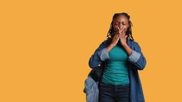 African american woman covering eyes, ears and mouth with hands, imitating the three wise monkeys. Girl doing do not see, do not hear and do not speak gesturing concept, studio background, camera B video