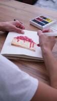 young woman drawing watercolor picture at home video