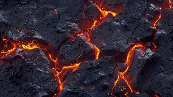 A black rock with orange lava on it photo