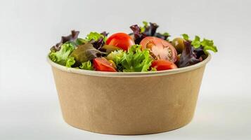 Take away salad in disposable craft paper bowl on white background, food concept mockup photo