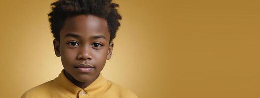 An African American Kinfolk Boy Isolated On A Yellow Background With Copy Space. photo