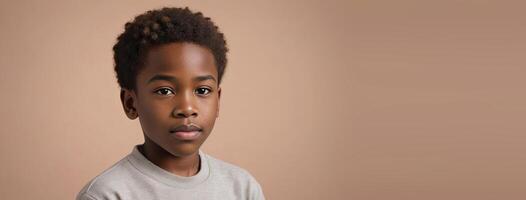 1012 Years African American Boy Isolated On A Peach Background With Copy Space. photo