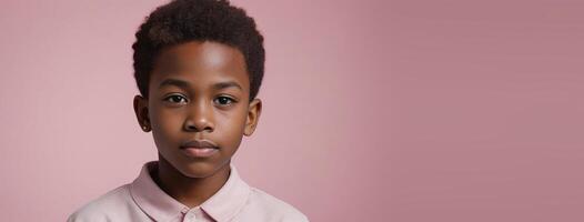 An African American Juvenile Boy Isolated On A Pink Background With Copy Space. photo