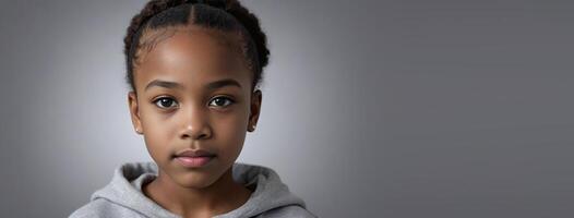 An African American Youthful Girl Isolated On A Silver Background With Copy Space. photo