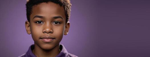 An African American Juvenile Boy Isolated On A Amethyst Background With Copy Space. photo