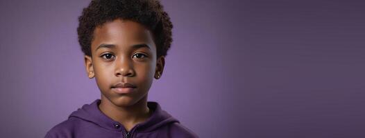 An African American Juvenile Boy Isolated On A Amethyst Background With Copy Space. photo