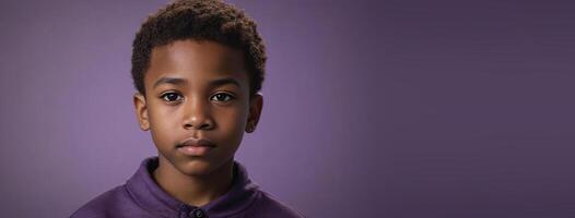 An African American Juvenile Boy Isolated On A Amethyst Background With Copy Space. photo