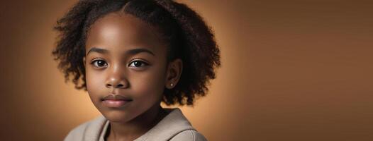 1012 Years African American Juvenile Girl Isolated On A Amber Background With Copy Space. photo