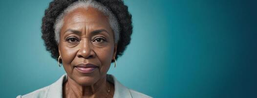 African American 70S Elderly Woman Isolated On A Aquamarine Background With Copy Space. photo