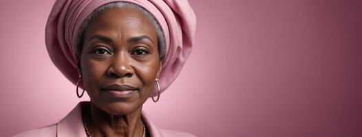 African American 70S Elderly Woman Isolated On A Pink Background With Copy Space. photo