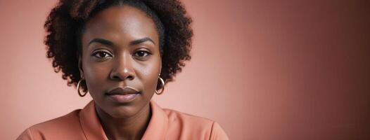 A 50S Adult African American Woman Isolated On A Coral Background With Copy Space. photo