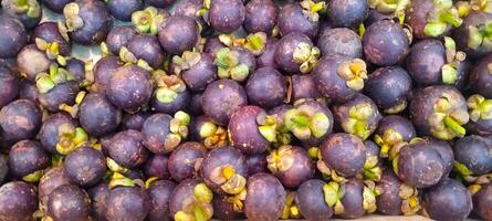 Full frame shot of mangosteen for sale at market stall photo