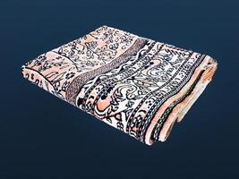 Folded Muslim prayer mat used to pay on dark background photo