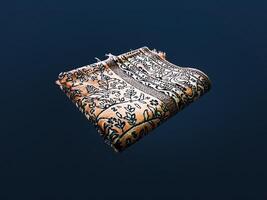 Folded Muslim prayer mat used to pay on dark background photo