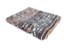 Folded Muslim prayer mat used to pay on white background photo